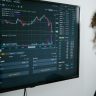 Detailed view of a financial analysis chart on a monitor with cryptocurrency trading data.
